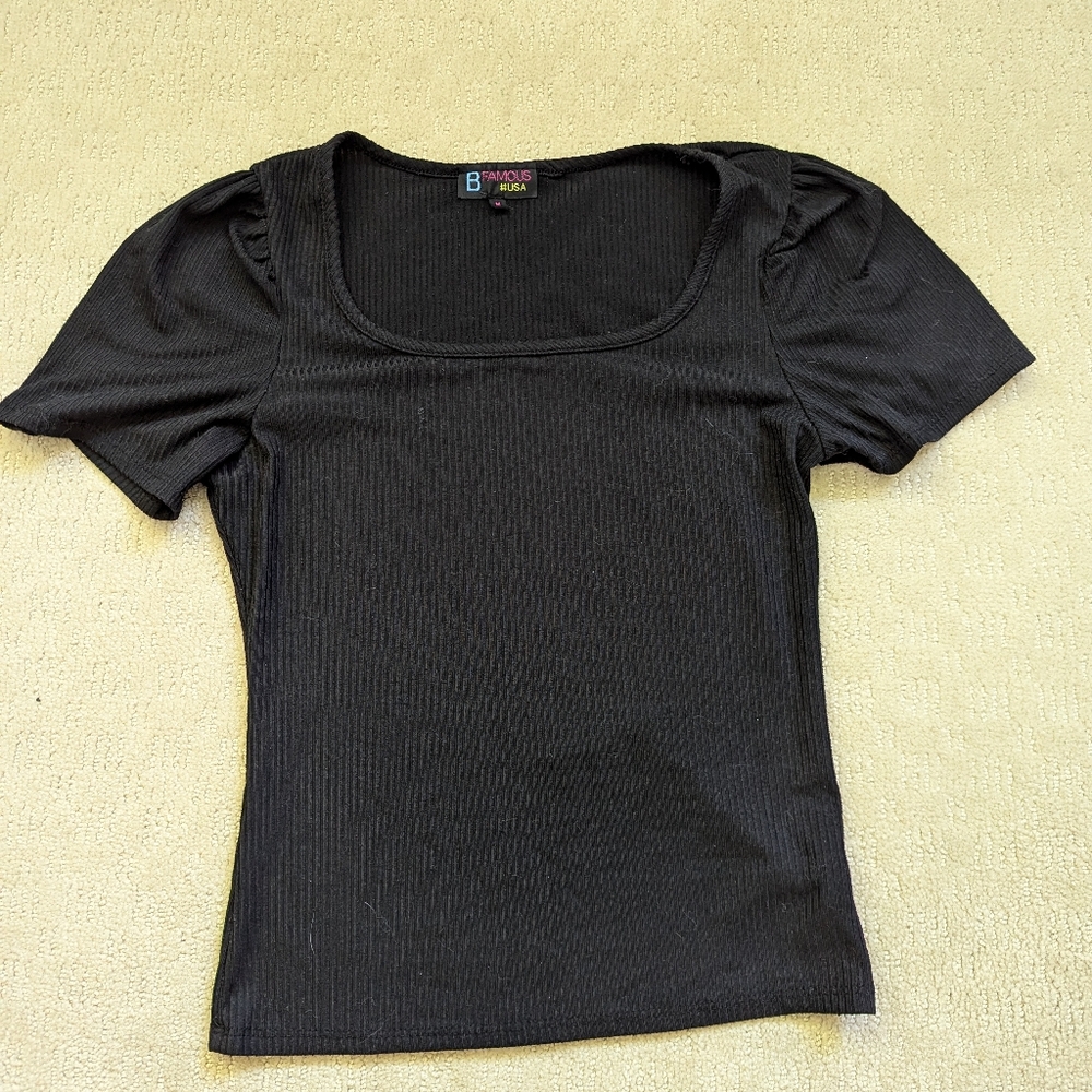 Ribbed black top with poofy sleeves